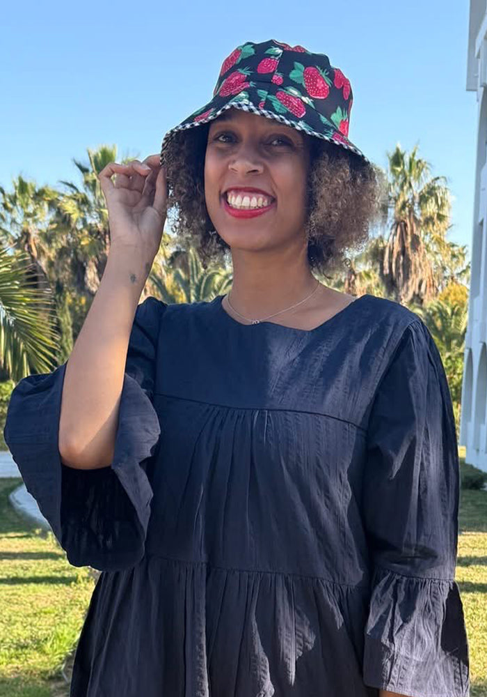 Front view of Strawberry Print Reversible Bucket Hat