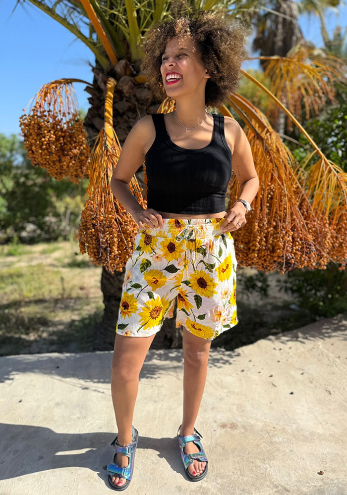 Front view of Lue White Sunflower Print Woven Shorts