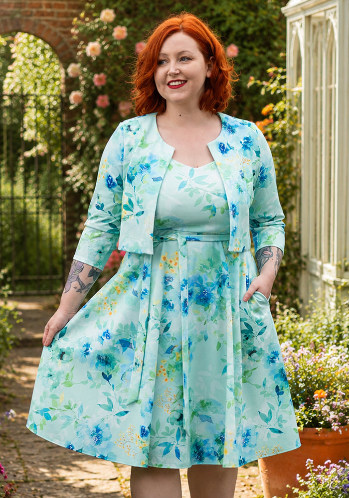 Third angle of Rylah Blue Floral Scuba Crepe Bolero Jacket, soft blue bolero with floral inspired print.