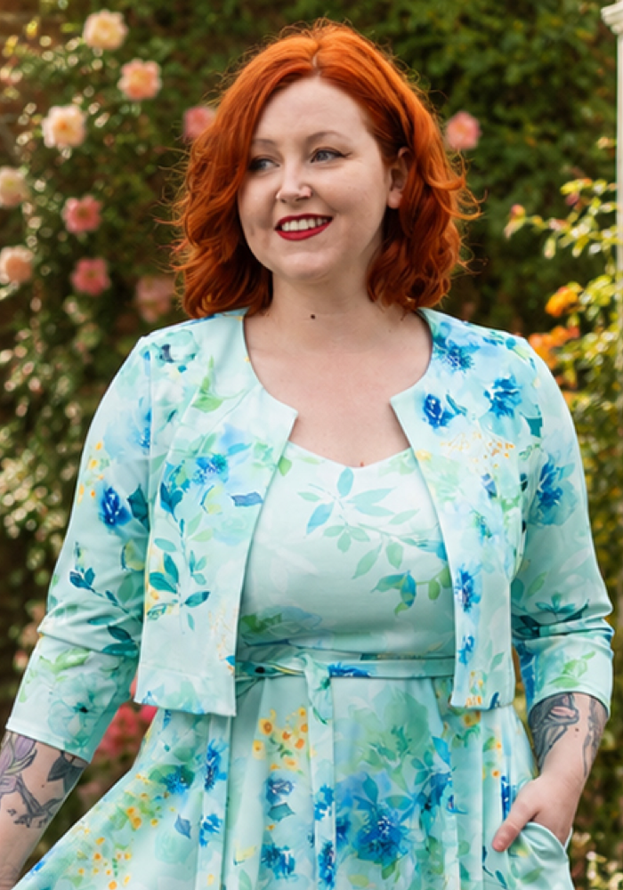 Front view of Rylah Blue Floral Scuba Crepe Bolero Jacket, soft blue bolero with floral inspired print.